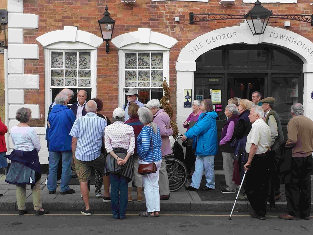 In front of the George Inn, with our backs to the Co-op 